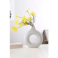 https://www.burton.co.uk/product/living-and-home-13cm-w-x-14cm-h-white-nordic-style-donut-shape-ceramic-vase_p-6ae6e5be-4218-4095-8276-2ff1d396c0db£colour=White&size=One%20Size