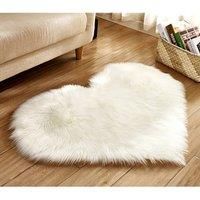 https://www.burton.co.uk/product/living-and-home-40-x-50cm-heart-shaped-super-soft-shaggy-area-rug_p-9049c7eb-2685-41b1-bb20-1fbb054df228£colour=White&size=40cm%20x%2060cm
