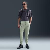 Chelsea F.C. Tech Men's Nike Football Fleece Joggers - Green - Cotton/Polyester