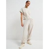 adidas Women/'s Essentials 3-Stripes Lifestyle Woven Parachute Pants, Wonder Alumina/White, S