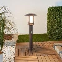 Lindby LED pillar lamp Pavlos in rust, motion detector