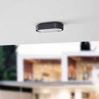 Lindby LED outdoor wall light Niniel, black/white, oval