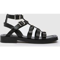 schuh tempeny studded sandals in black