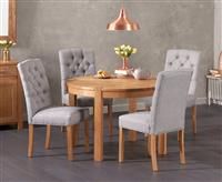 Thetford 110cm Oak Round Dining Table with 4 Grey Isabella Chairs