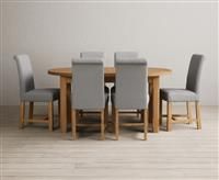 Extending Caversham Oak Oval Dining Table with 10 Natural Scroll Back Chairs