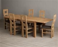 Thetford 150cm Oak Dining Table with Thetford 45cm Oak Extensions with 10 Cream Natural Solid Oak Chairs