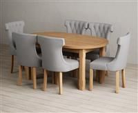 Extending Caversham Oak Oval Dining Table with 10 Natural Clara Chairs
