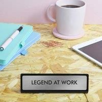 https://www.burton.co.uk/product/flamingo-candles-legend-at-work-desk-plate-sign_p-53d4e4a4-ee1b-4508-81fb-661aaa2077cb£colour=Gold&size=One%20Size